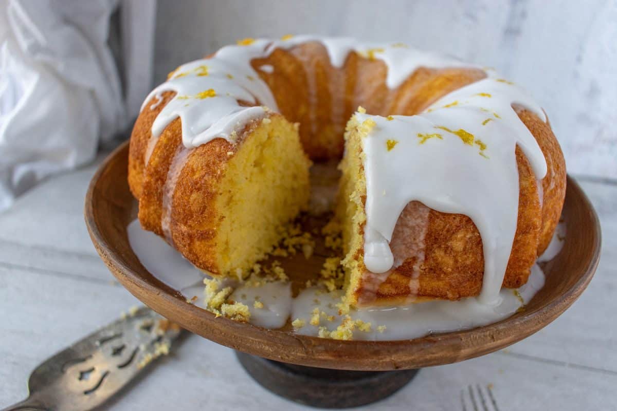 A sliced bundt cake with white icing