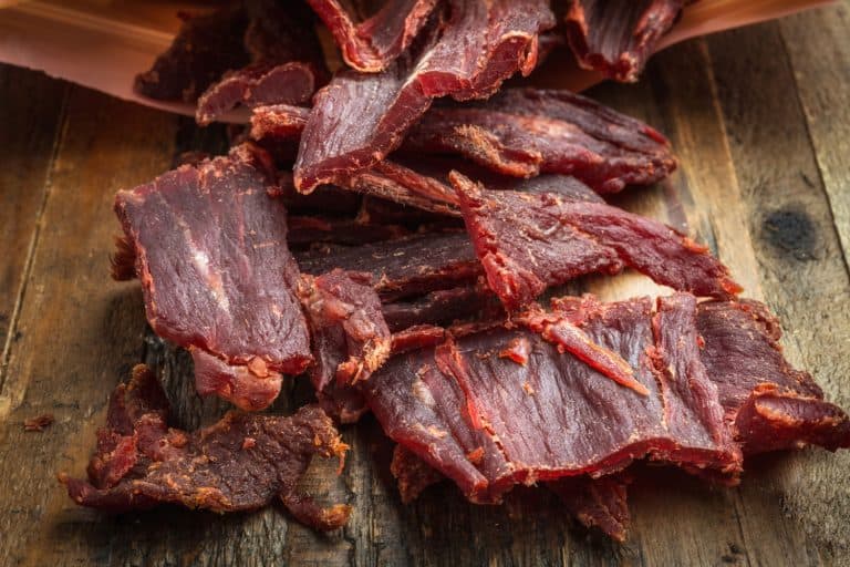 An up close and detailed photo of a beef jerky placed on a table, How To Make Beef Jerky In Convection Oven [7 Easy-To-Follow Steps!]