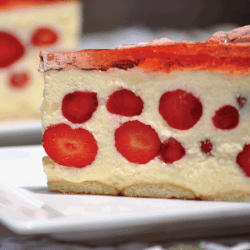 Close up of two pieces of strawberry- vanilla cream pie with strawberry jello. How To Properly Store A Cheesecake