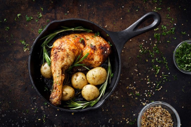 Delicious fried chicken cooked in a frying pan with oregano and potatoes, Should You Butter Turkey Or Chicken Before Roasting?