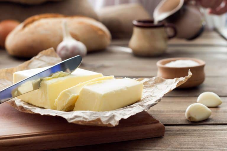 Freshly opened unsalted butter placed on top of a chopping board, Can You Refreeze Butter?