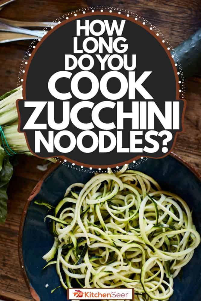 Perfectly sliced Zucchini noodles on a small bowl with forks and a break knife on the table, How Long Do You Cook Zucchini Noodles?