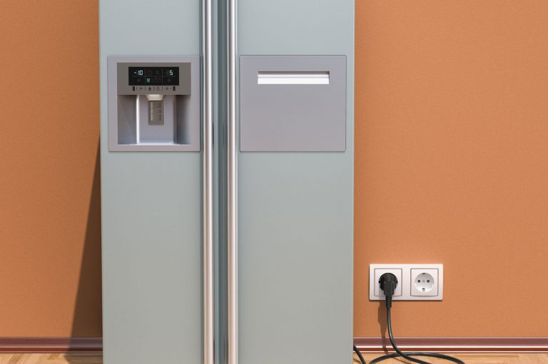 Modern fridge with side-by-side door system in interior, How Many Amps Does A Refrigerator Use?