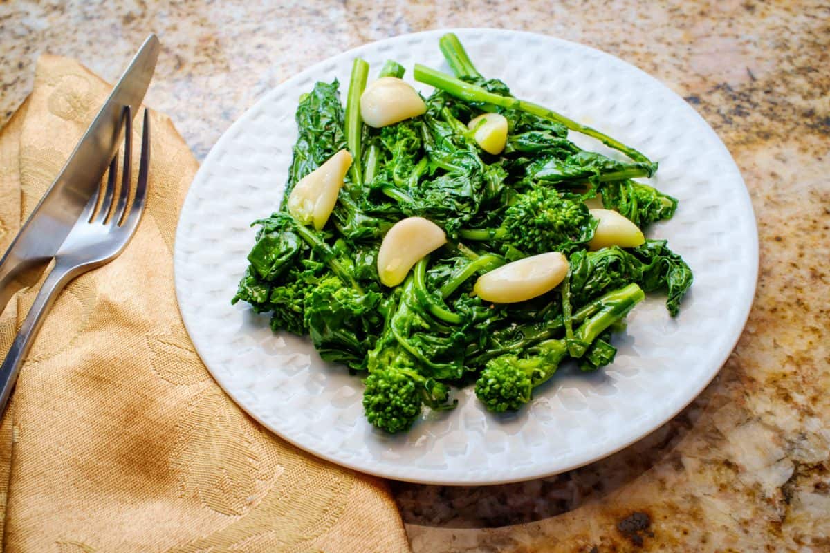 Sautéed broccoli with garlic served on a small platter