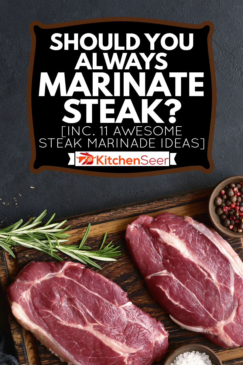 Raw organic marbled beef steaks with spices on a wooden cutting board on a black slate, stone or concrete background, Should You Always Marinate Steak? [Inc. 11 Awesome Steak Marinade Ideas]