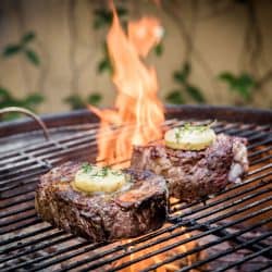 Two huge rump steak cuts grilled with butter melting on top of the steak, Should You Cook Steak In Butter Or Oil?