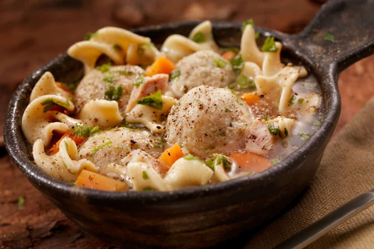 A classic favourite! Fluffy matzo balls floating in roasted chicken noodle soup