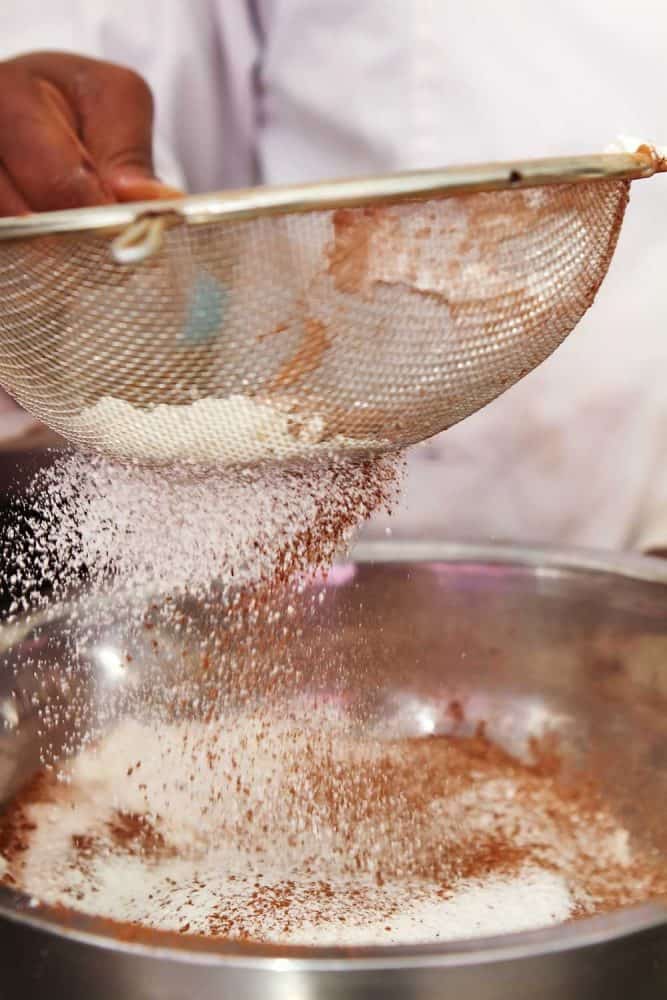 Close up of motion, flour being sifted to make a cake