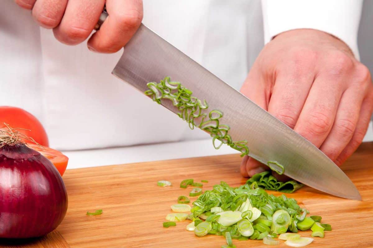 Chopping vegetables for salad preparation