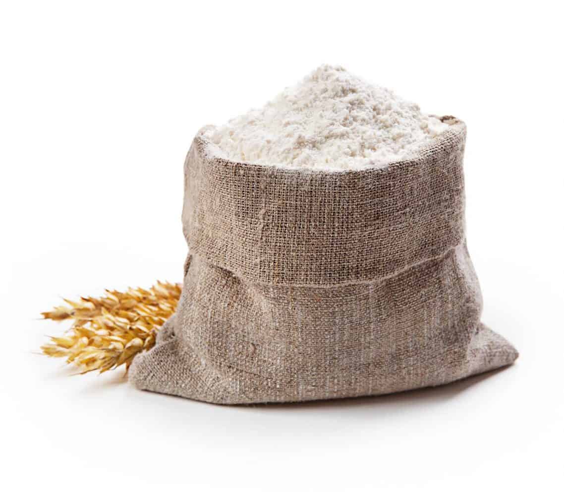 Flour in bag with wheat ears