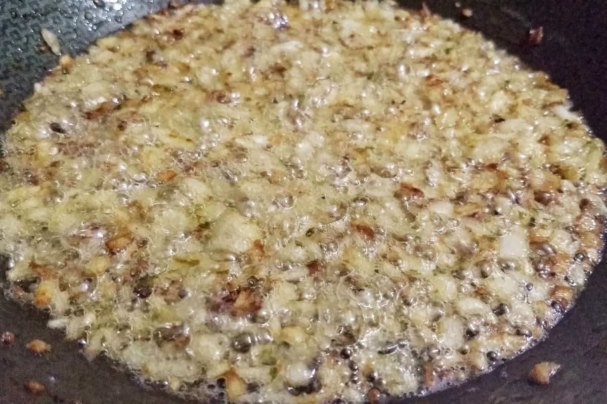 Frying garlic and onions in a pan