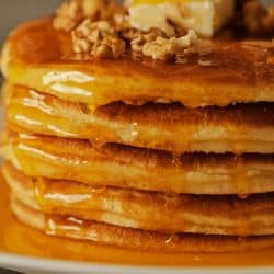 Maple syrup dipping over stacked pancakes, Can You Make Pancakes With Self Rising Flour?