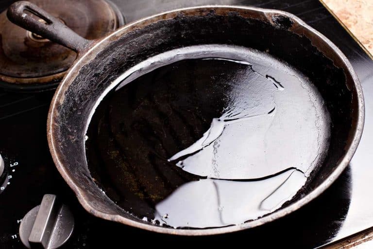 Old cast iron skillet with oil, What Oil Is Best For Cast Iron Cooking?
