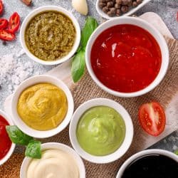 Set of sauces in ramekins and spoons on stone background, Do Ramekins Come In Different Sizes?