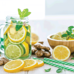 Some-lemon-slices,-ginger-roots-and-two-green-and-white-drinking-straws.-Does-Microwaving-Lemons-And-Lime-Make-Them-Juicier