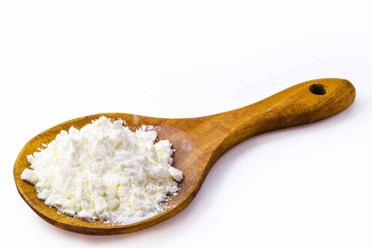 Spoon with cornstarch, flour made from corn used to make creams or as a thickener