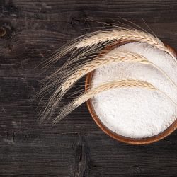Whole wheat flour and wheat placed on top, How Long Does Whole Wheat Flour Last?