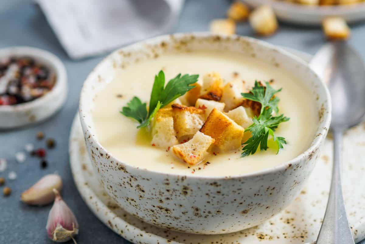 cauliflower potato soup puree on stone background,Creamy cauliflower soup with toasted bread croutons