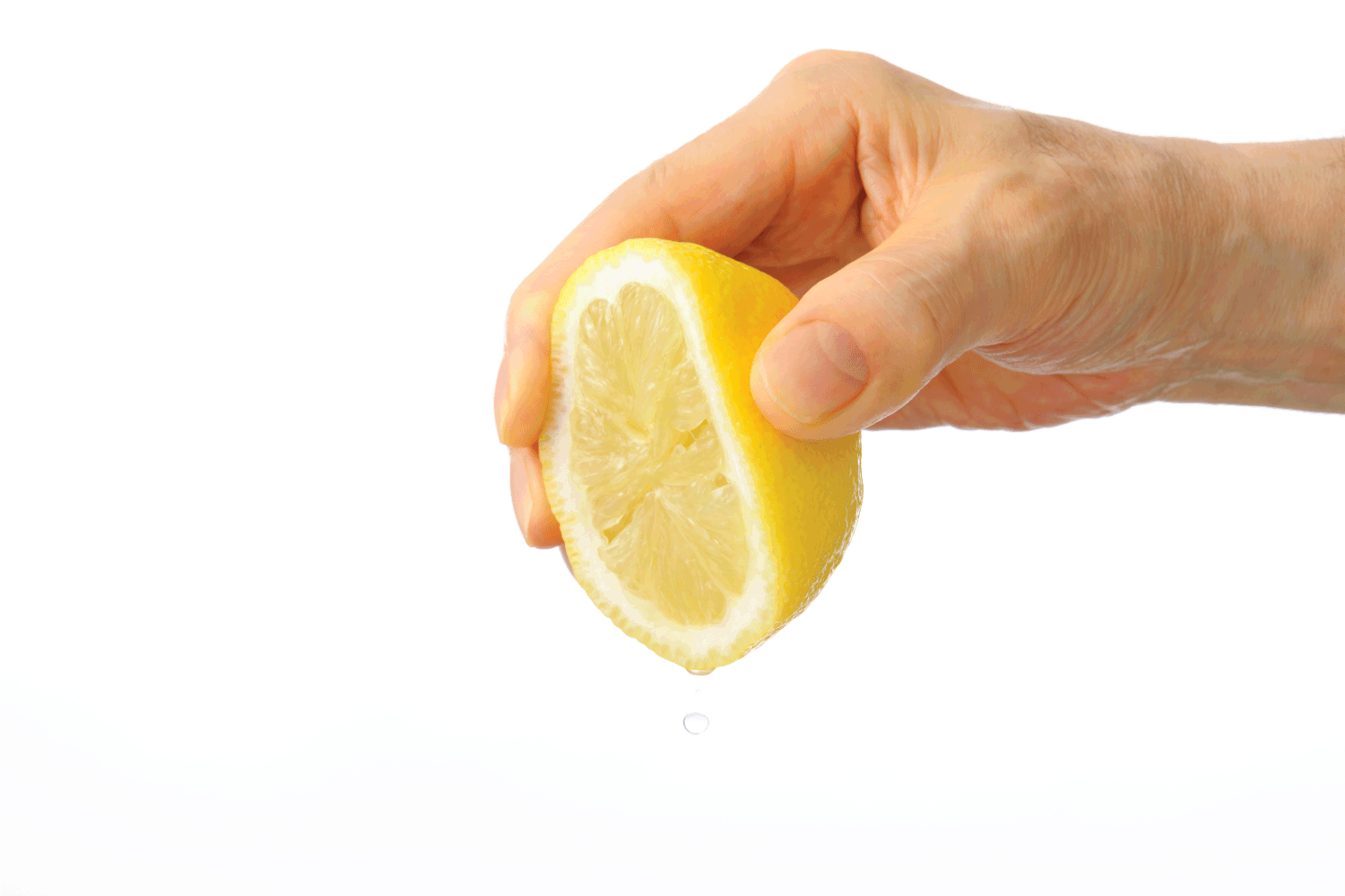 hand squeezing a lemon