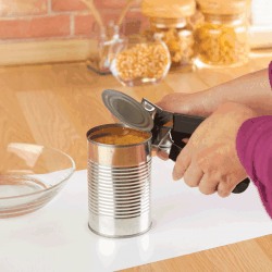 woman-opening-a-can-of-corn-with-can-opener-in-the-kitchen.-How-Long-Should-A-Can-Opener-Last