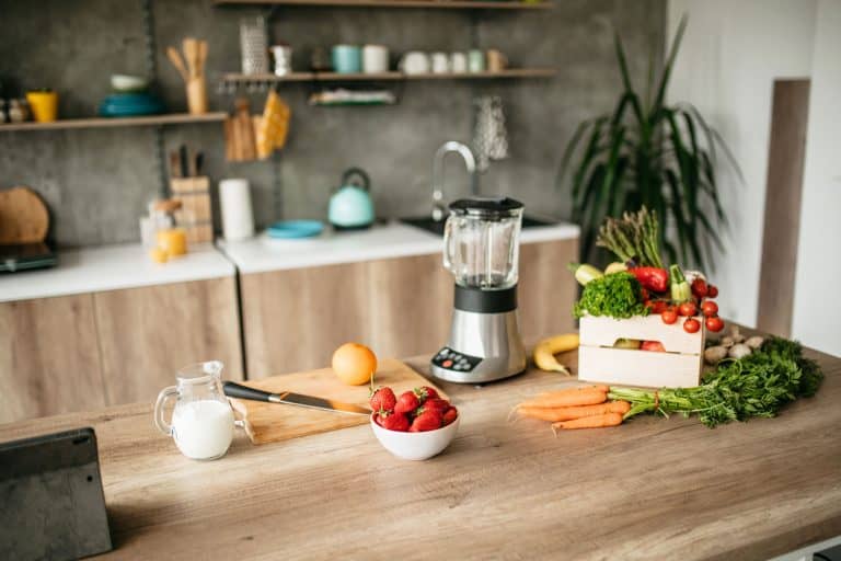 A blender and Healthy food standing on the kitchen table, Can A Blender Be Used As A Grinder?
