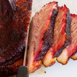 A medium rare cooked beef brisket perfectly sliced into pieces, Is A Bread Knife Good For Cutting Brisket?