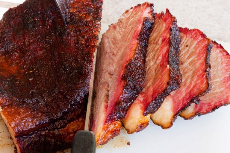 A medium rare cooked beef brisket perfectly sliced into pieces, Is A Bread Knife Good For Cutting Brisket?