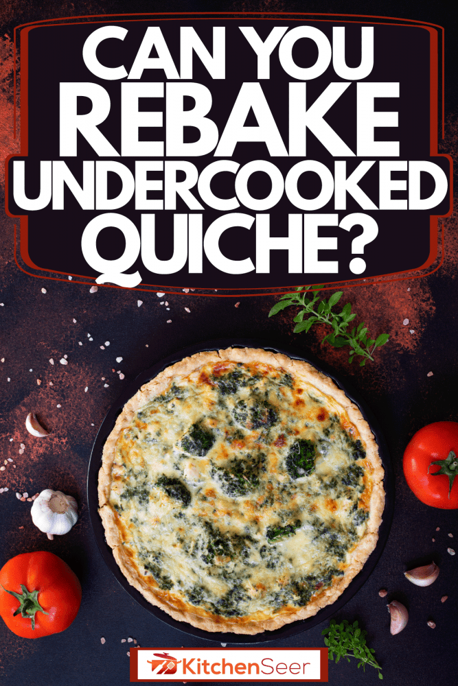 An up close photo of a perfectly cooked French quiche using vegetables and spinach with garlic and tomatoes on the side, Can You Rebake Undercooked Quiche?