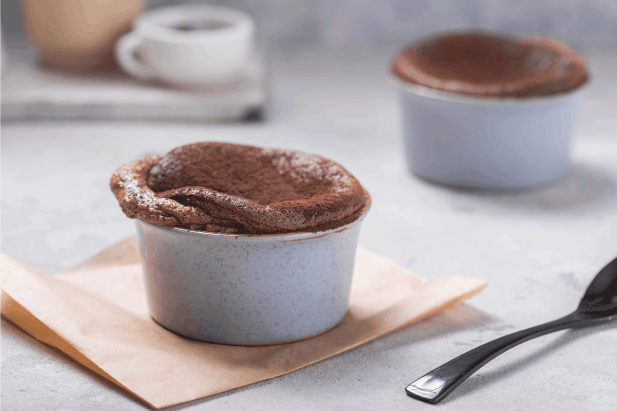 Chocolate Souffle with frozen blueberry . French traditional dessert. Are Ramekins Broiler Safe