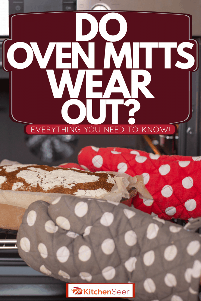A woman wearing oven mitts removing fresh oven baked bread, Do Oven Mitts Wear Out? [Everything You Need To Know!]