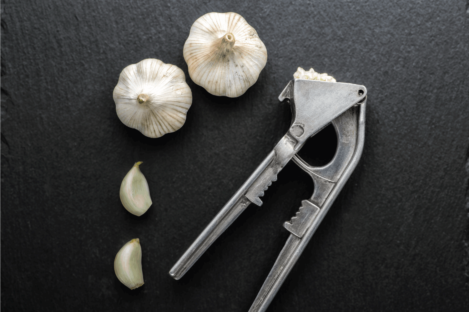 Garlic press and garlic