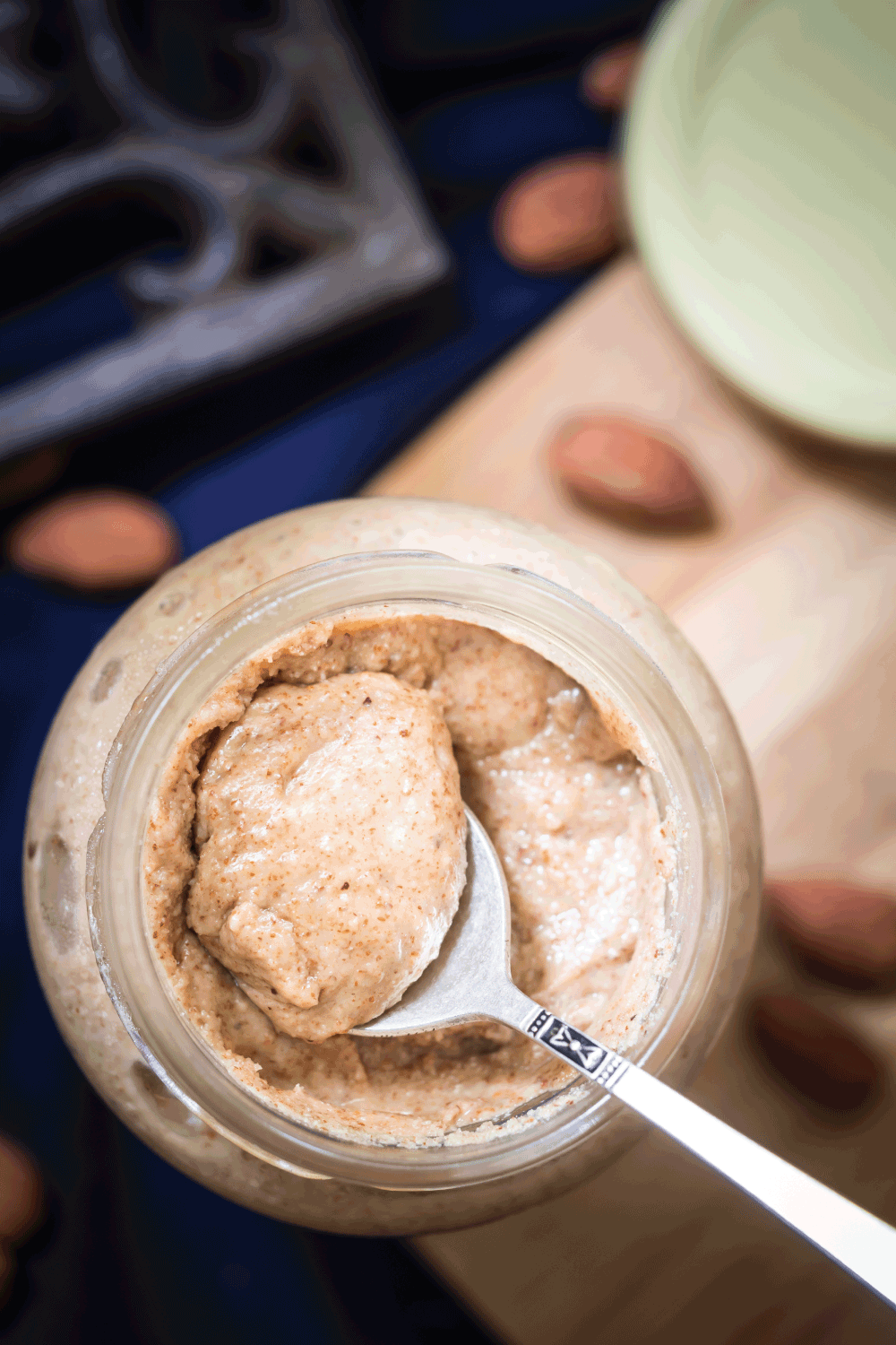 Homemade almond butter in a mason jar with spoon