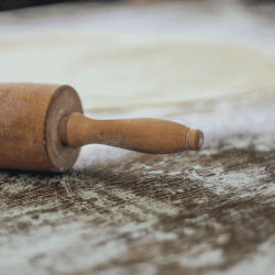 Rolling pin and flattened dough. Should You Oil A Wooden Rolling Pin
