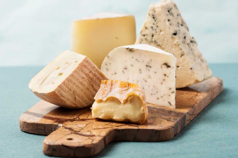 Variety of cheeses on marble serving board, Is A Cheese Board A Starter Or Dessert?
