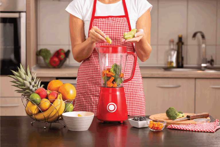 female hands putting fresh cucumbers into a blender bowl for making a vegetable broth, What Are The Parts Of A Blender