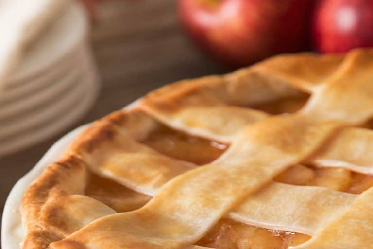 A lattice apple pie with apples on the table, Does Apple Pie Freeze Well?