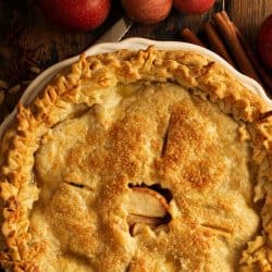 Apple pie decorated with fall leaves overhead shot, fall baking concept, Is Apple Pie Okay Left Out Overnight? [Best Storage Tips]