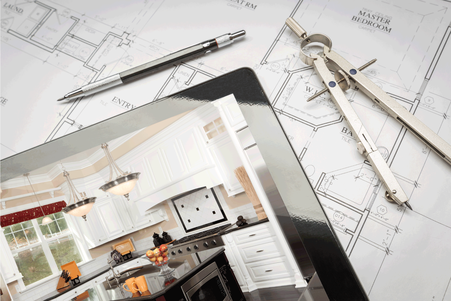 Computer Tablet Showing Kitchen Illustration On House Plans, Pencil, Compass.