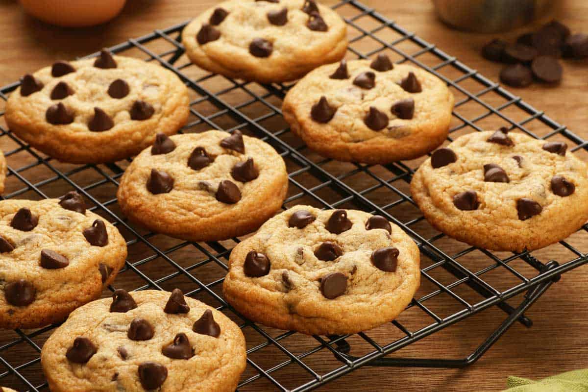 Freshly baked chocolate chip cookies cooling on a cooling rack, How Big Of Chocolate Chip Cookies To Make?