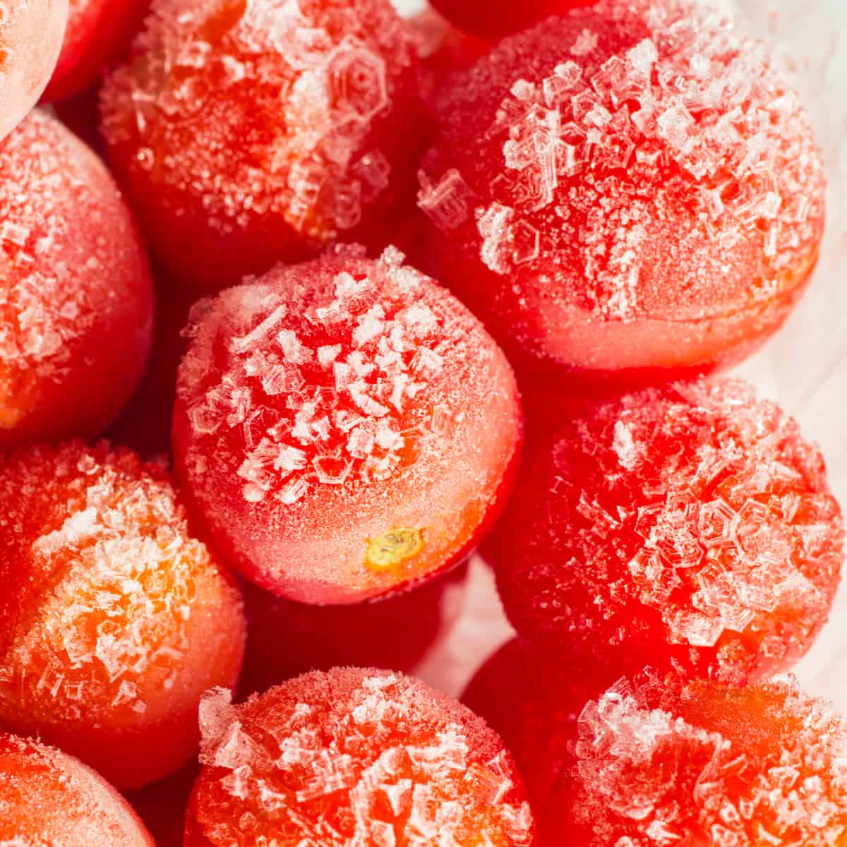 Frozen tomatoes covered with hoarfrost. close-up