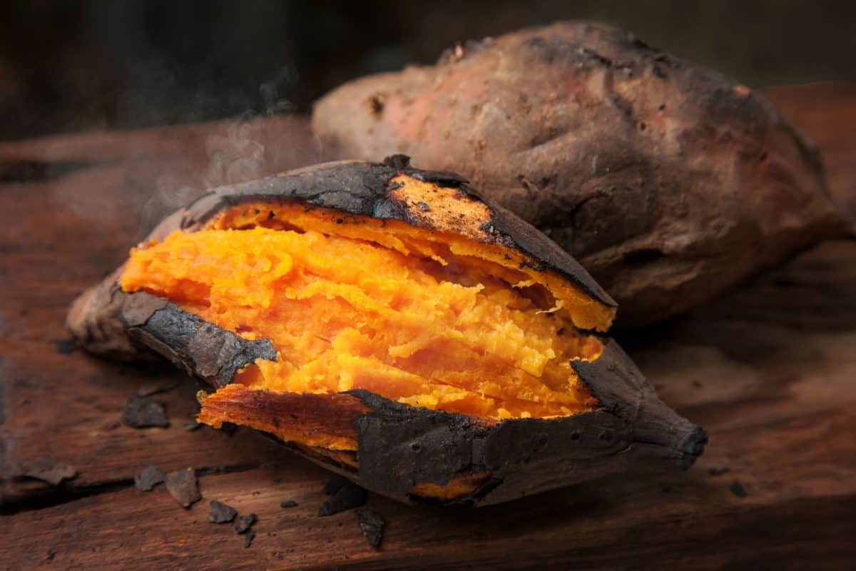 Oven roasted sweet potatoes on a wooden chopping board