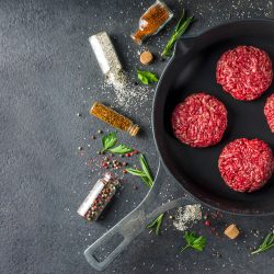 Raw minced meat beef burger cutlets. Cooking meat and burgers background with olive oi, How Long Do You Fry Or Grill Hamburgers On Each Side?