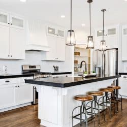 White gourmet kitchen with black countertops, Is A Kitchen Island Fixed To The Floor?
