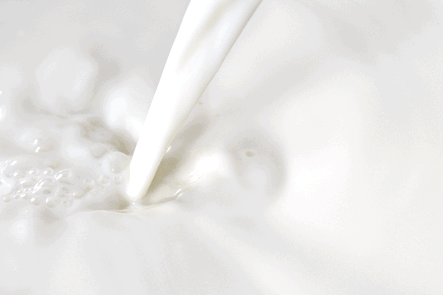 milk pouring close up photo