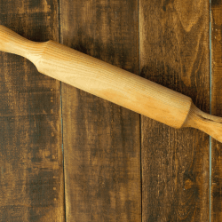 rolling pin on a wooden table.16 Types Of Rolling Pins To Know