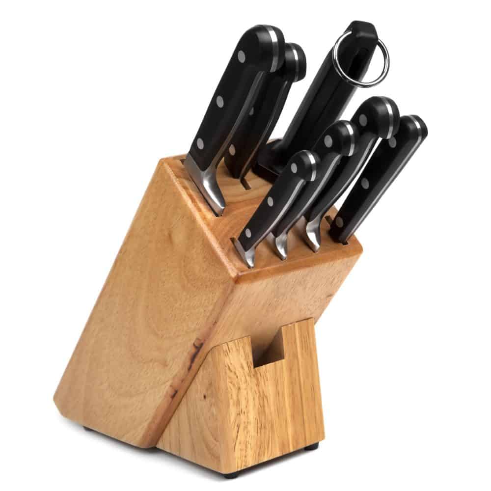 A knife block with different set of knives on a white background