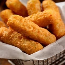 Basket of mozzarella cheese sticks, Should You Freeze Cheese Sticks Before Frying?