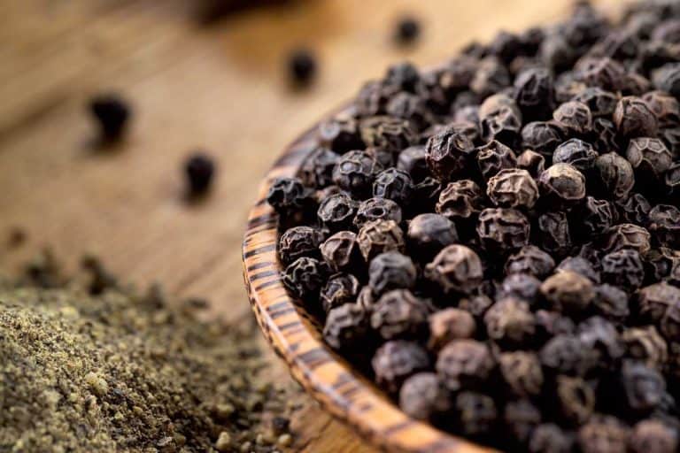 Black pepper in a bowl on wooden table, How Long Does Black Pepper Last?