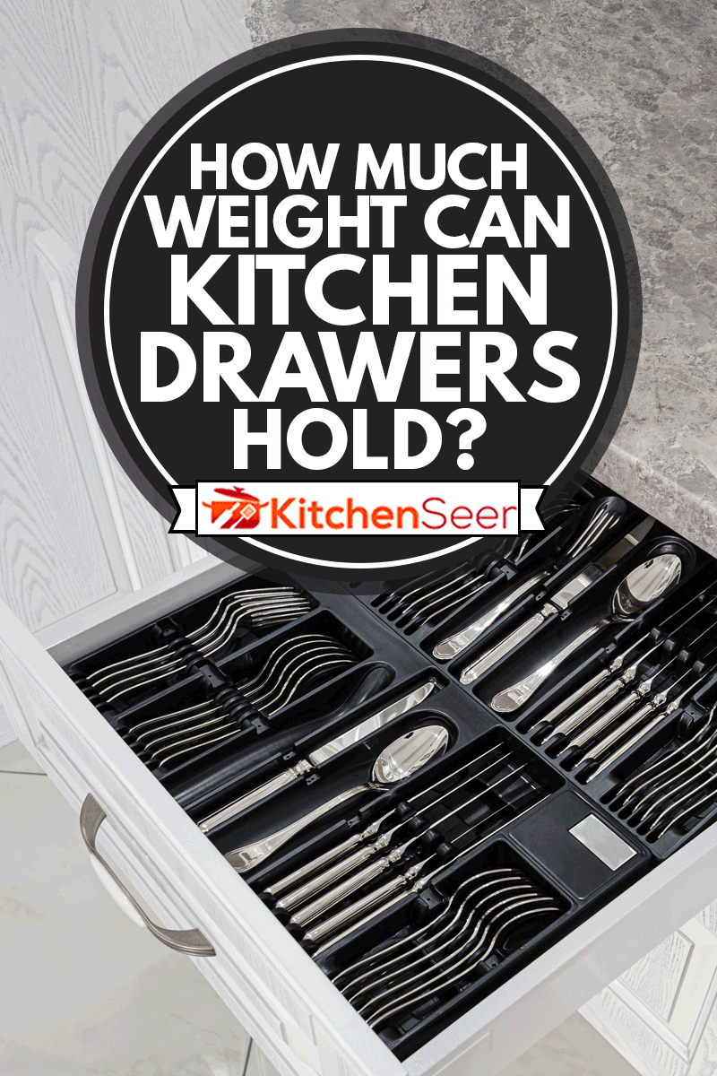 black open drawer with silver cutlery in modern white kitchen, How Much Weight Can Kitchen Drawers Hold?