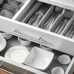 Ceramic dishware and cutlery in kitchen drawers, How To Remove Kitchen Drawers [A Complete Guide]